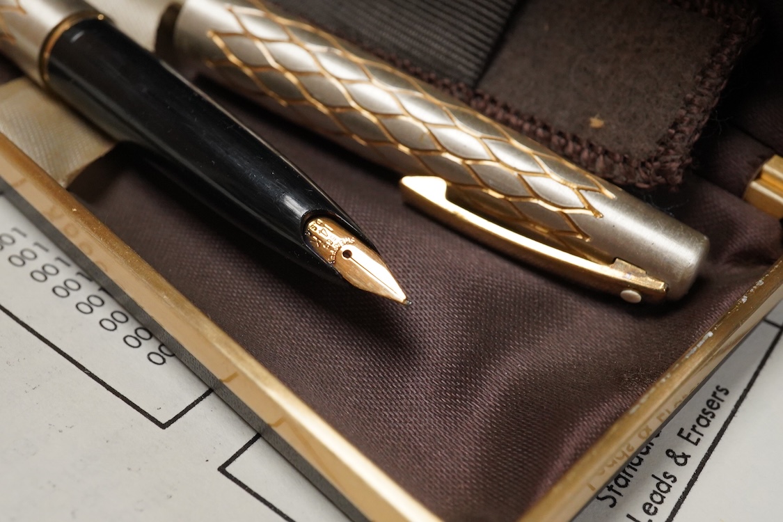 A folder of Parker and Sheaffer pens and ball pens, mostly boxed and a Parker Pen box containing eight items